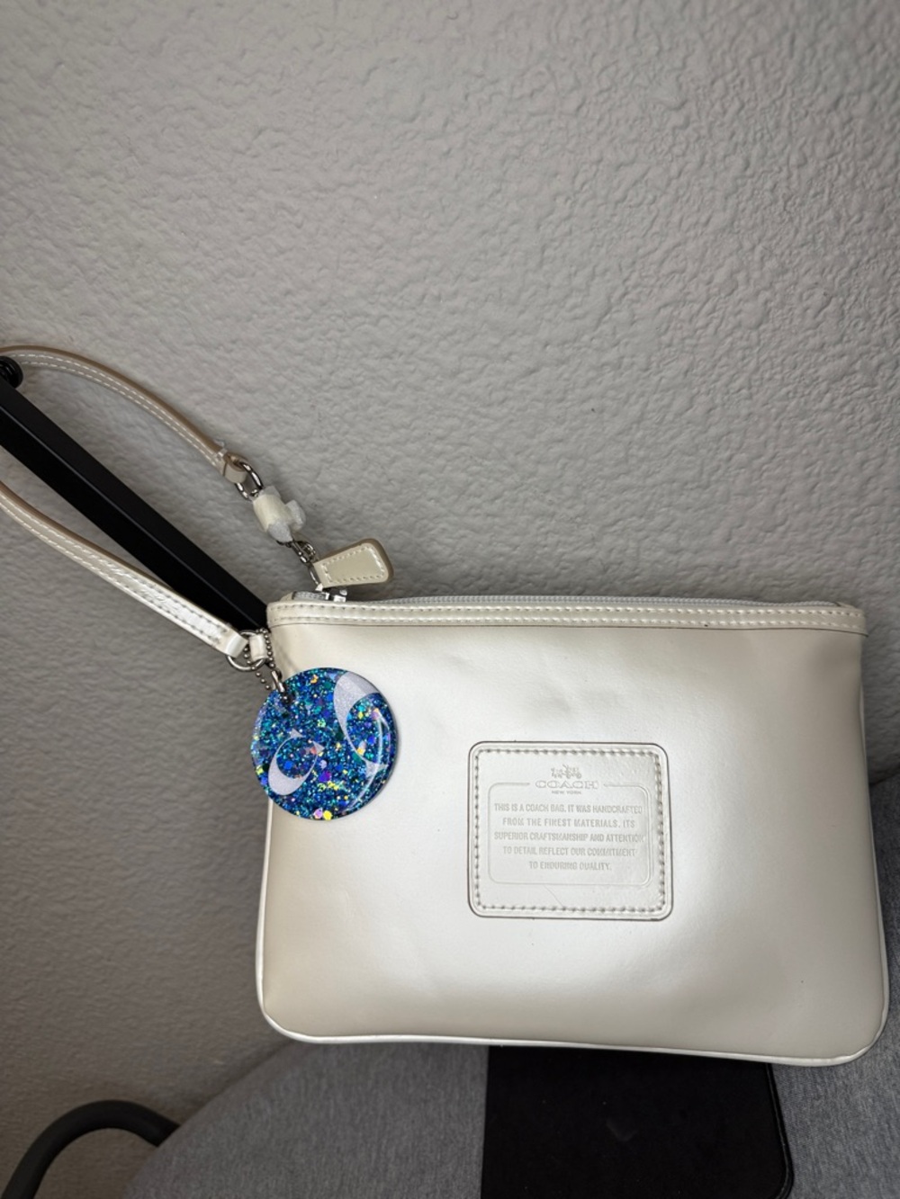 Coach Shimmering Ivory Leather Large Wristlet Clutch with Blue Glitter Charm